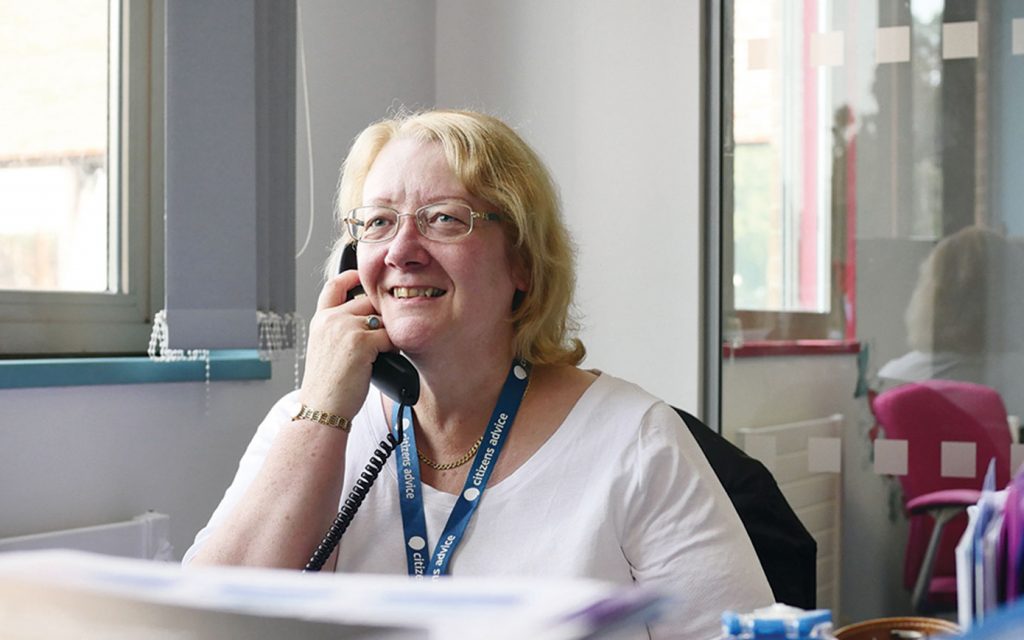 Our experienced Benefits and Money Advisor providing advice on PIP over the phone to someone affected by a brain tumour