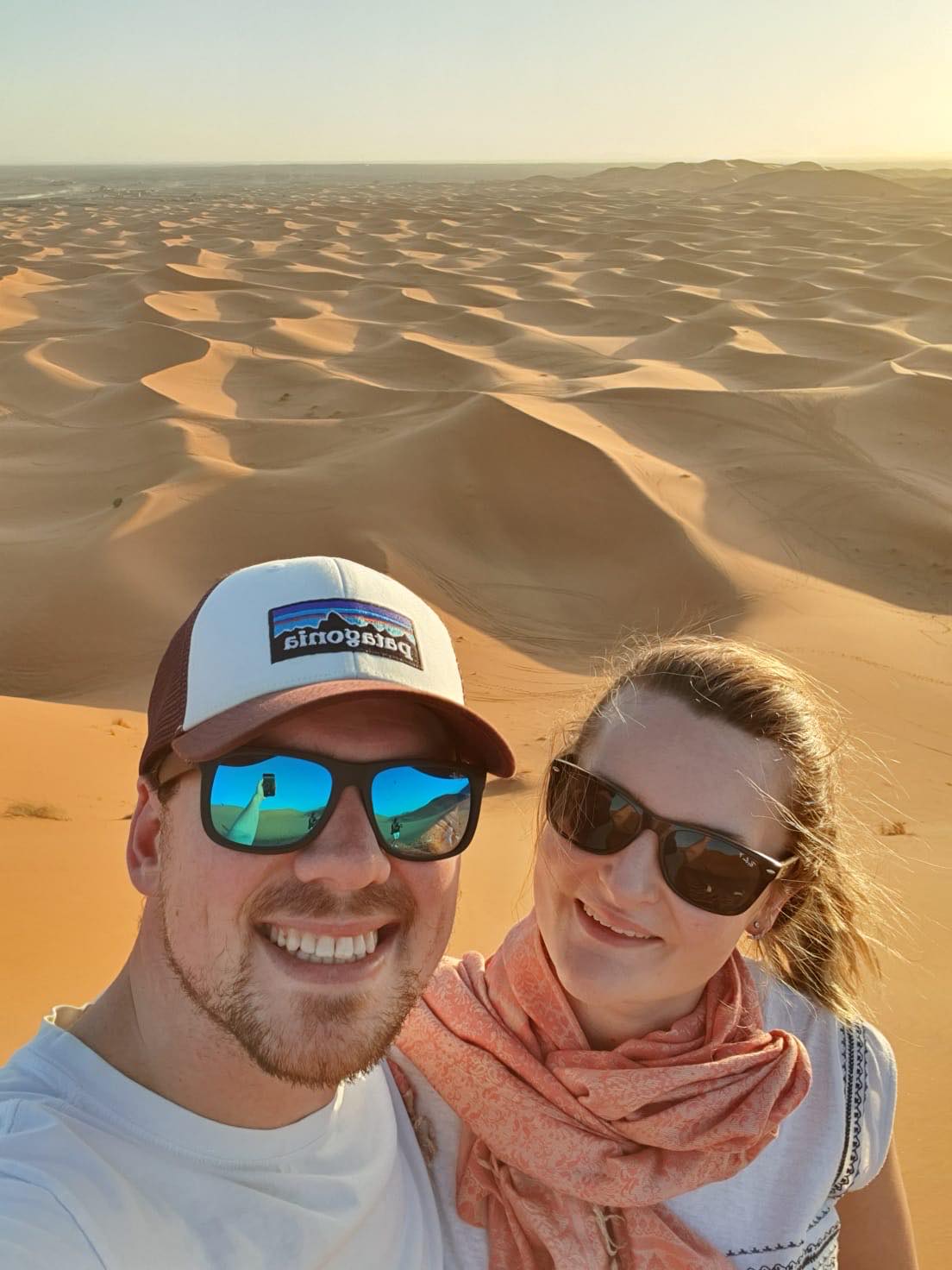 Chantal and Ryan taking a selfie among sand dunes