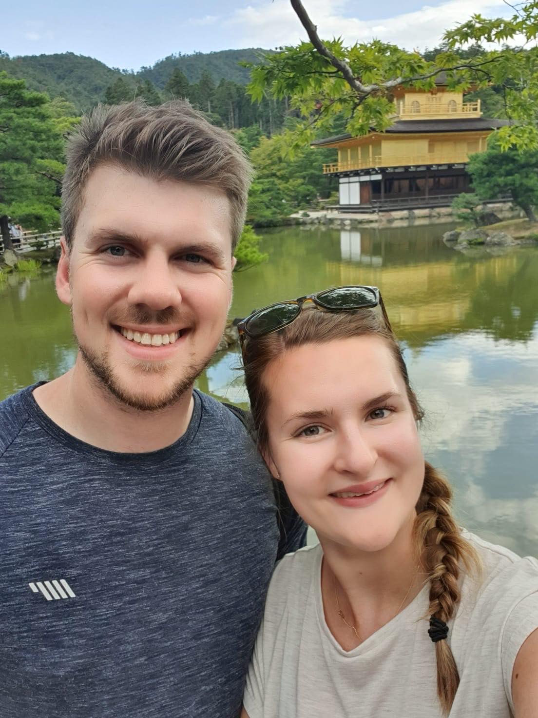 Chatal and Ryan taking a selfie with a river in the background.