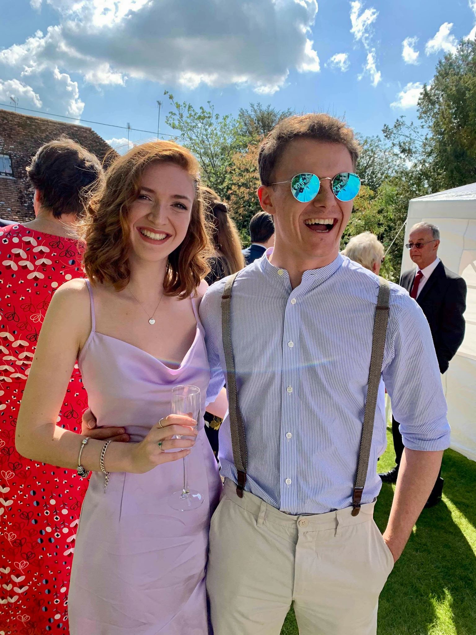 Lizzy and Matt dressed up fancy and smiling widely