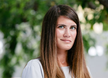 Emma Bassett, a primary school teacher who was diagnosed with a brain tumour at 13 in 2004, looks into the camera.