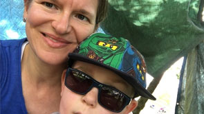 Rowan, an eight year old boy who was diagnosed with a low grade brain tumour in 2011, poses for a photo with his mum, Kerry.