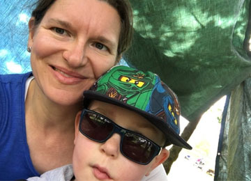 Rowan, an eight year old boy who was diagnosed with a low grade brain tumour in 2011, poses for a photo with his mum, Kerry.