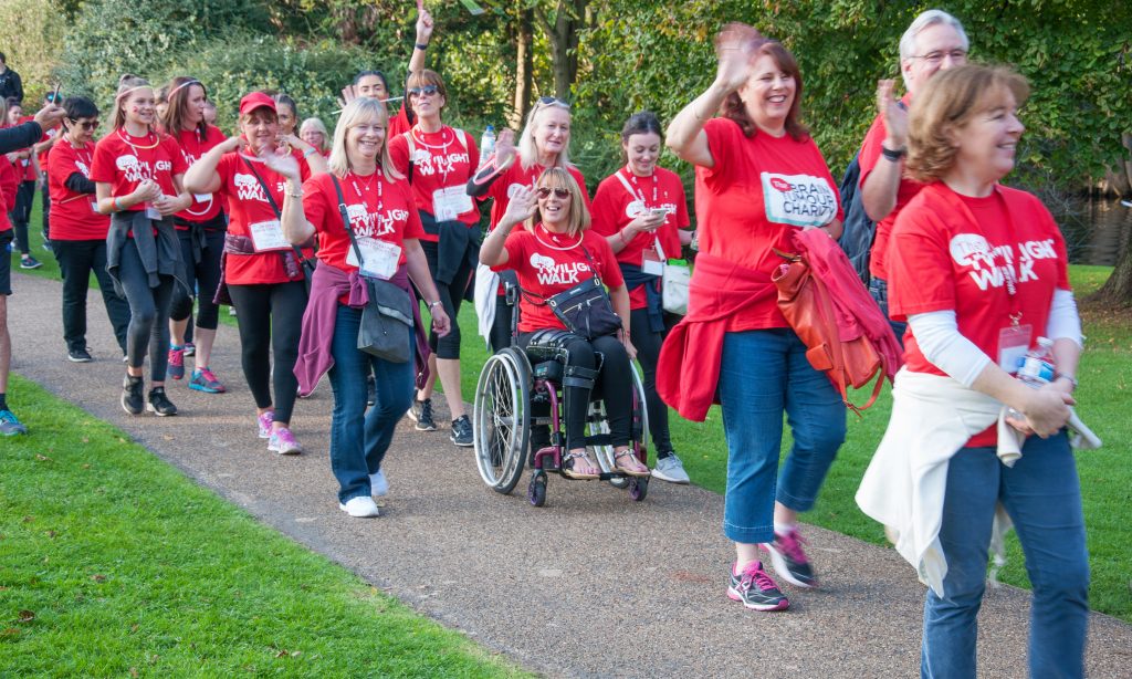 A photo of a diverse group of walkers marching towards progress at The Twilight Walk. Join us throughout Brain Tumour Awareness Month and together we can march towards a world where everyone affected by a brain tumour can live a longer, better life.