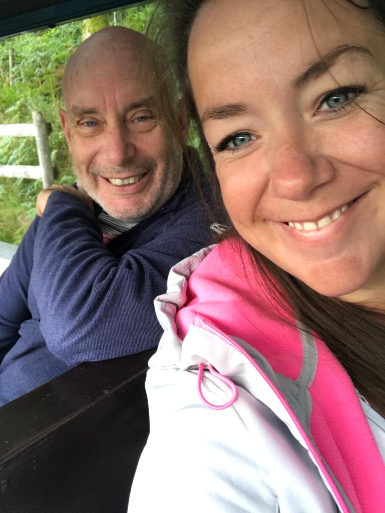 A selfie of a man and a woman, they are smiling at the camera.