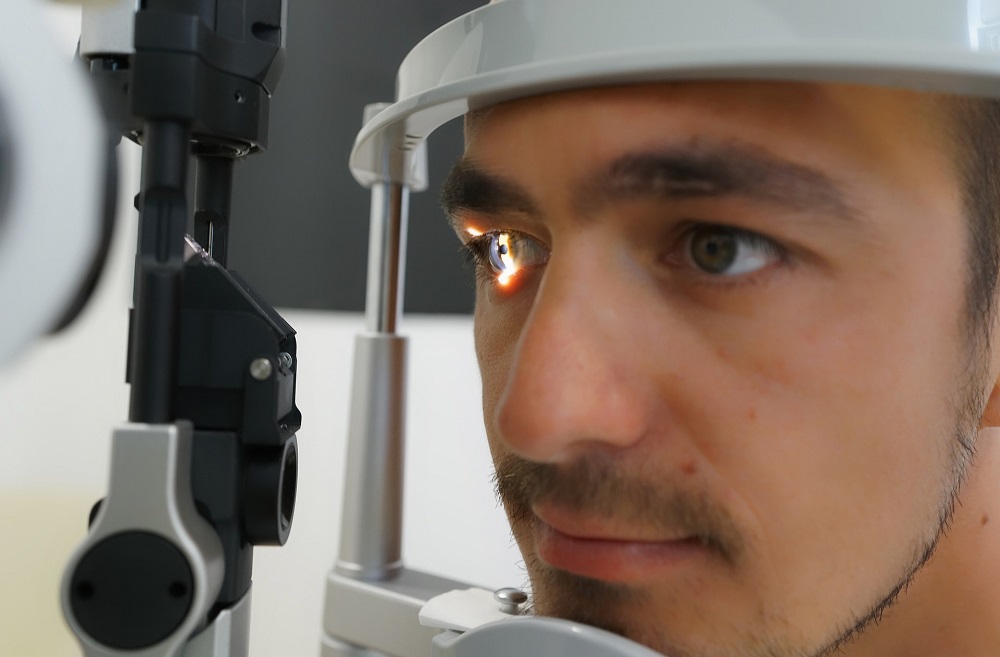 man getting eye test in search of a brain tumour