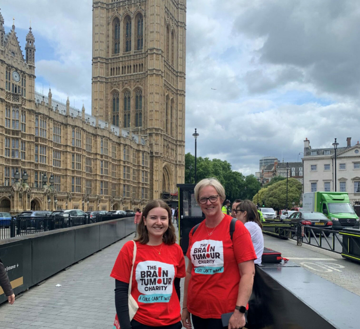 People wearing The Brain Tumour Charity t-shirts outside the Houses of Parliament in Westminster as they campaign for faster diagnosis of brain tumours