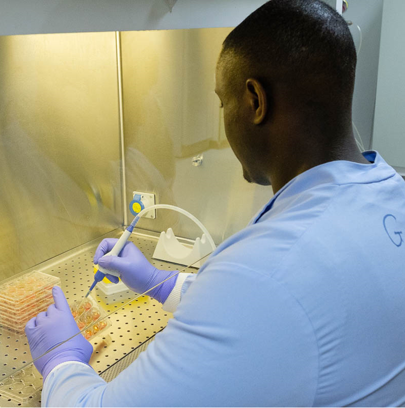 Ola Rominiyi works on samples in a laboratory