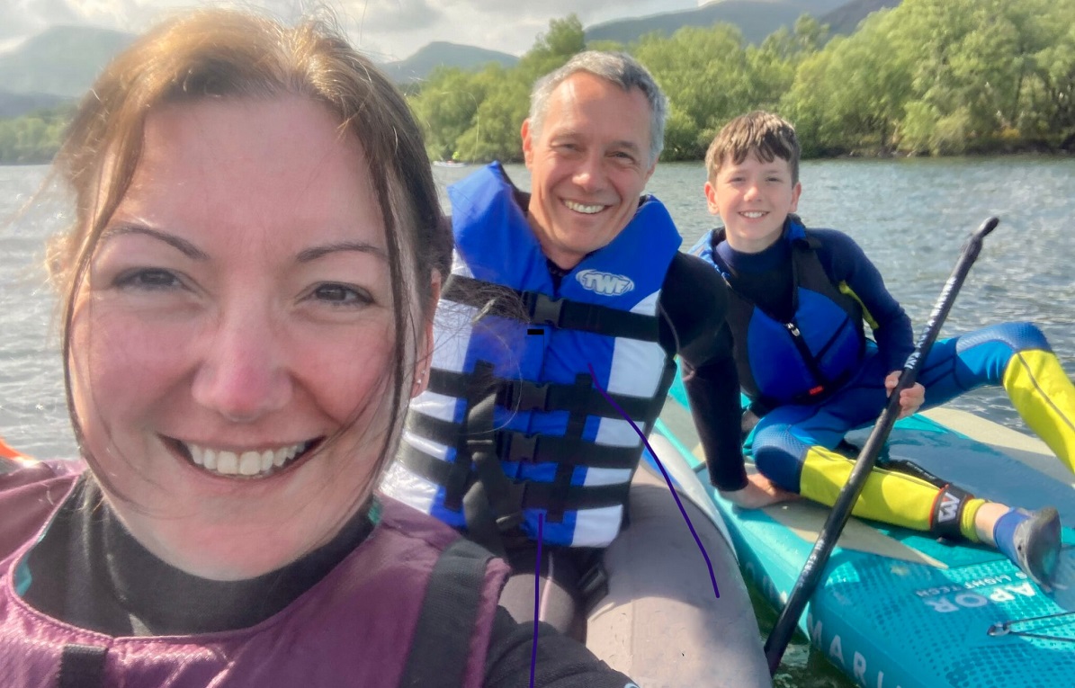 Simone Baldwin takes a selfie with her family on a kayak