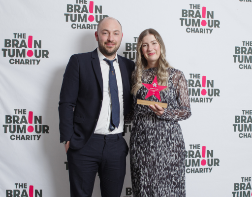 Jill's husband on the left and Jill pictured holding her award