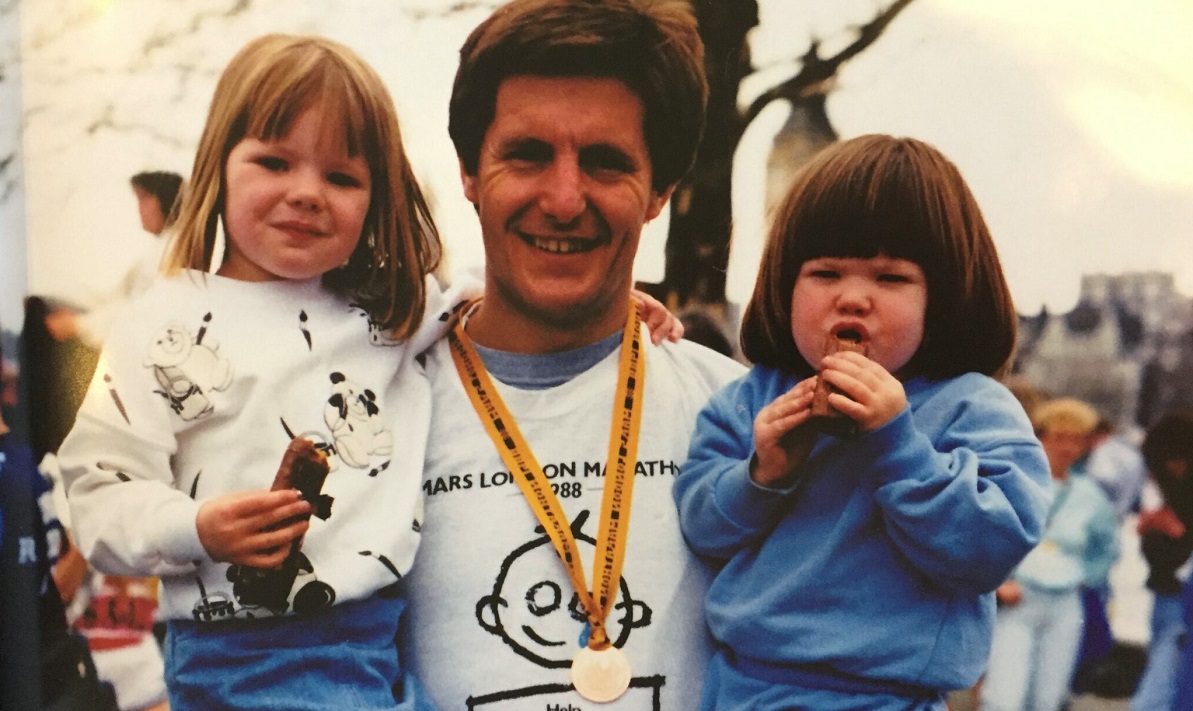 Photo of father holding his two daughters after completing the 1988 London Marathon