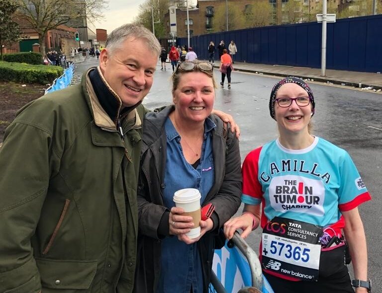 Camilla smiles with friends after completing the London Marathon