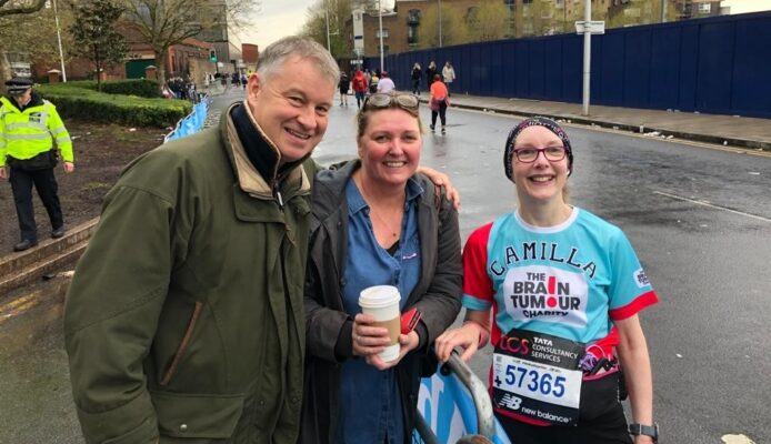 Camilla smiles with friends after completing the London Marathon