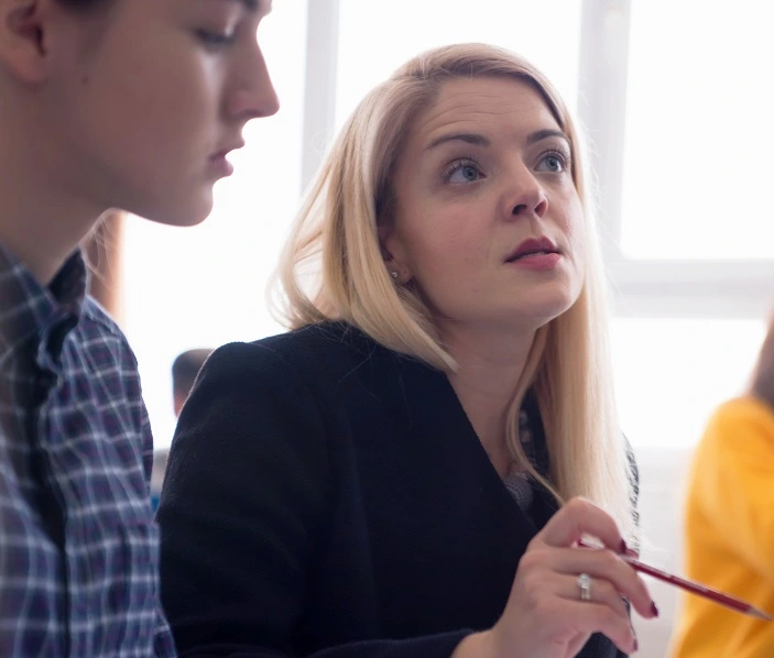 A speech and language therapist helps a student cope with speech and language difficulties