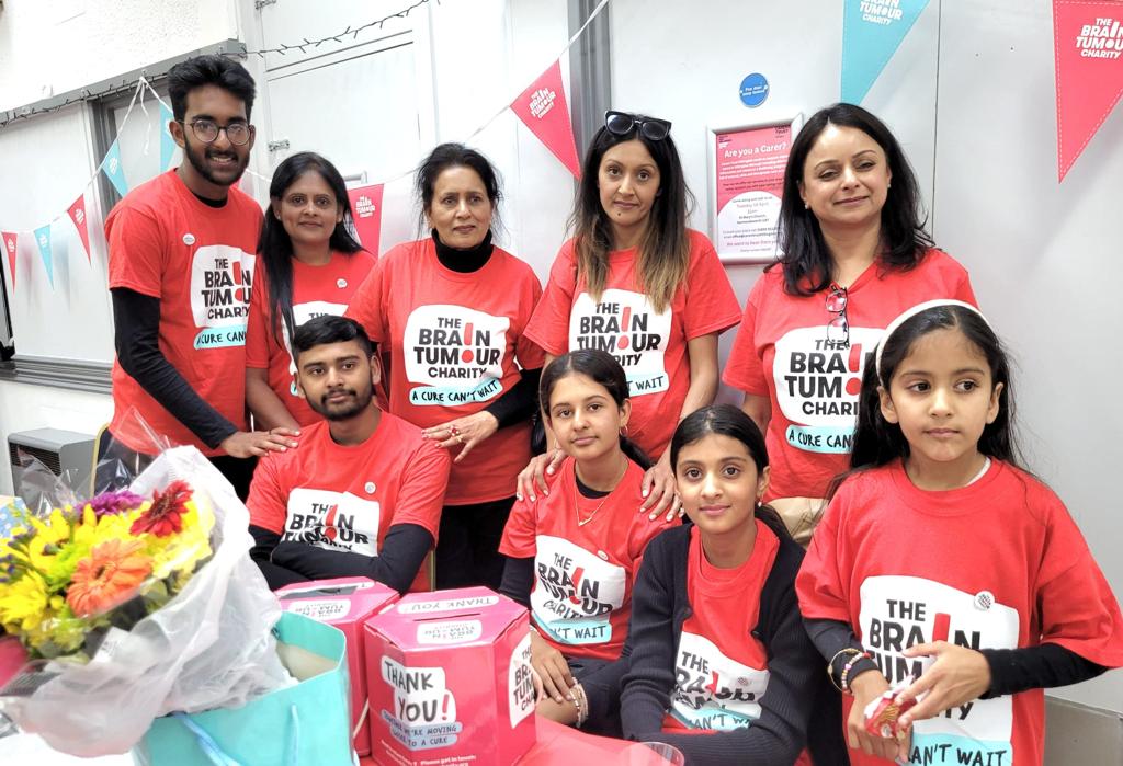 Volunteers for The Brain Tumour Charity smile while at a fundraising event