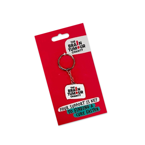 A metal keyring featuring The Brain Tumour Charity logo