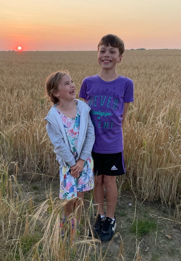 Harry Smith with his sister Emily in a during with a sunset