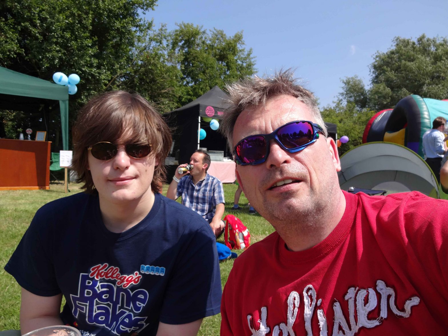 A picture of Joe and his father sitting in a field