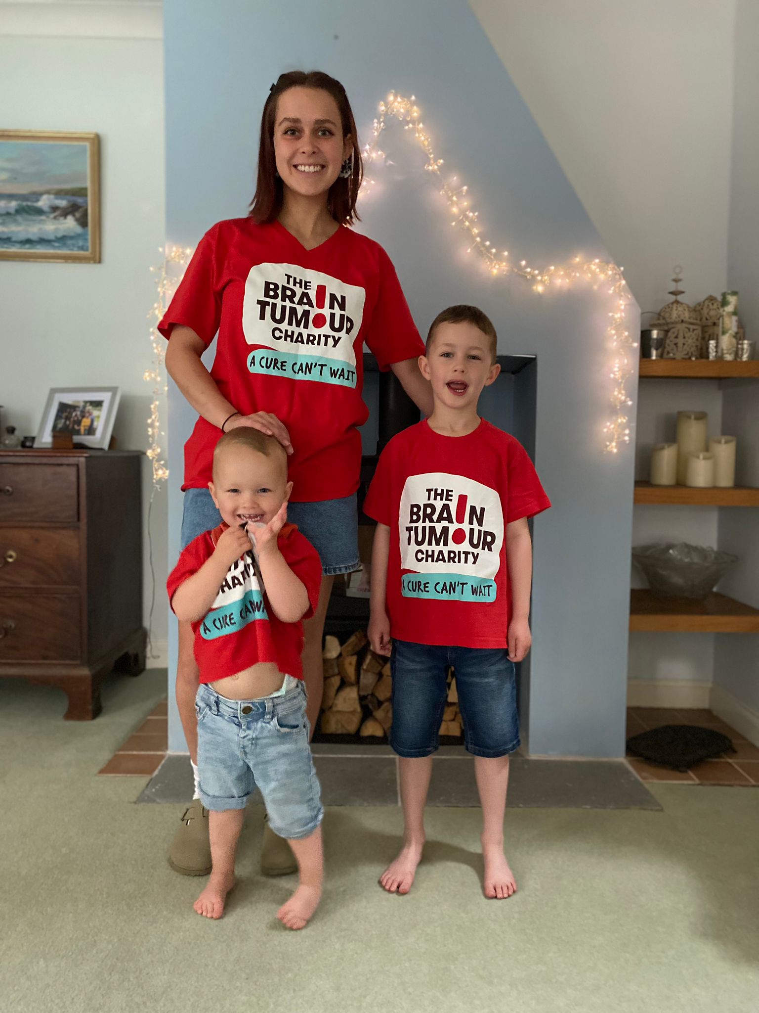 Siobhan Broadhurst stands in her living room with her two sons