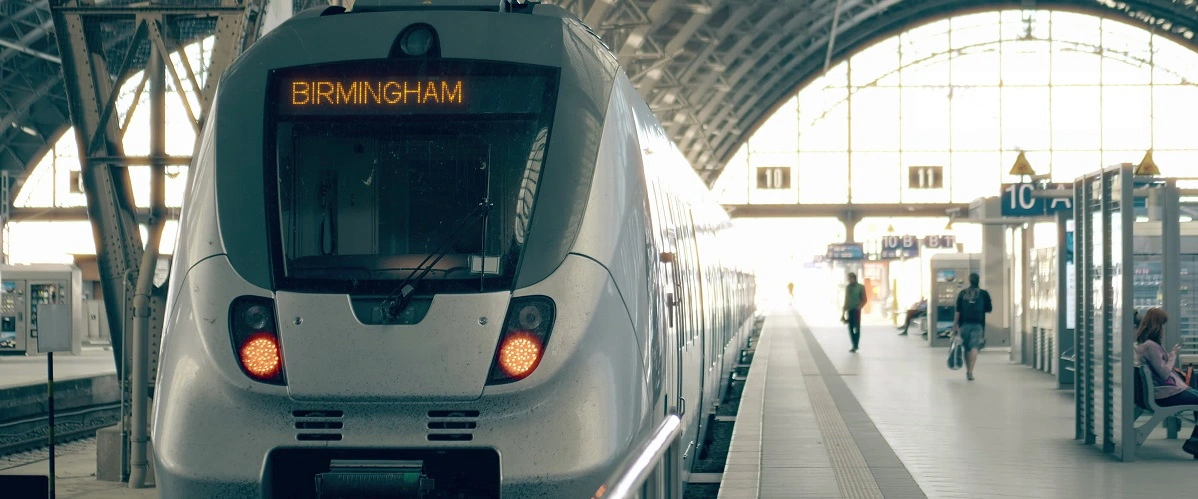 Train with destination set to Birmingham sitting at a station