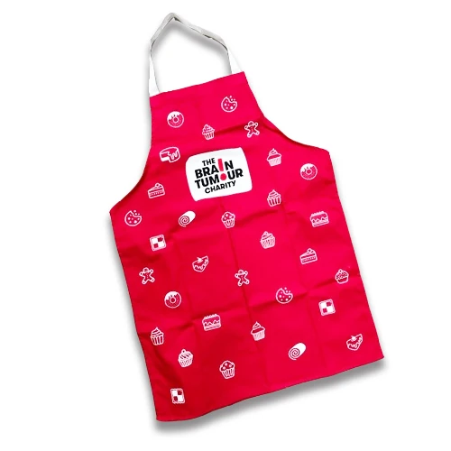 The Brain Tumour Charity branded baking apron on a white background