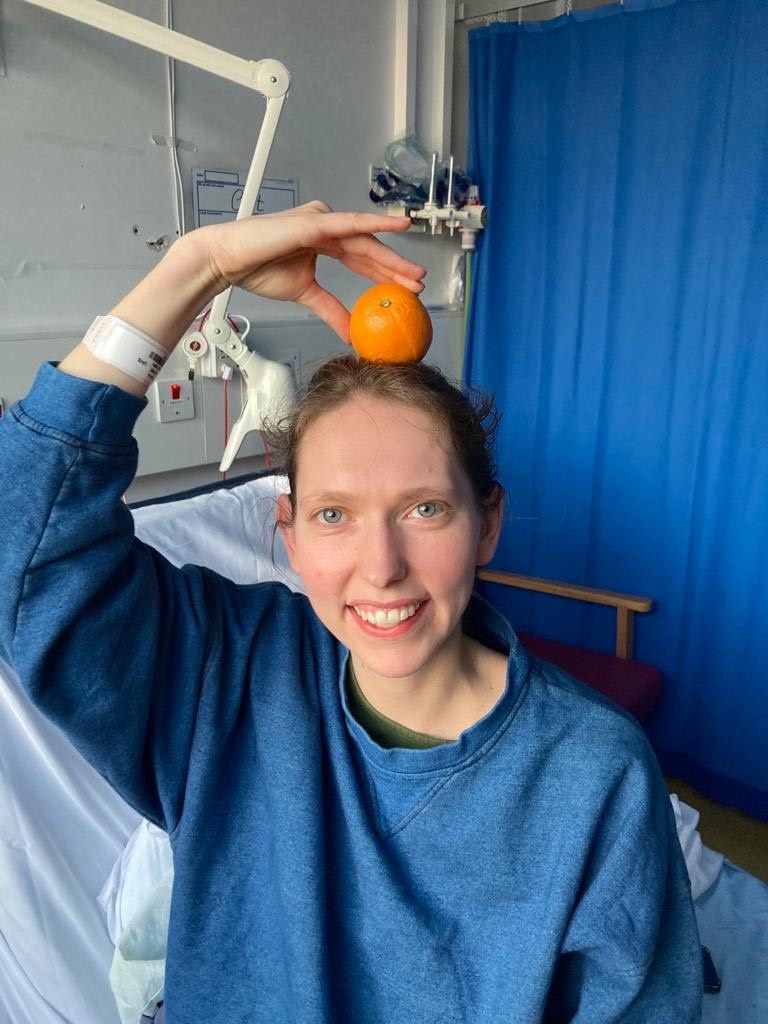 Catrin with an orange balanced on her head - the tumour was discovered after she initially ignored her symptoms