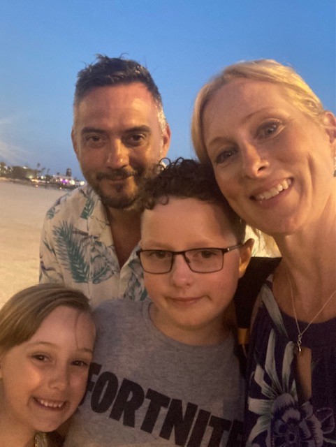 Zac, who was diagnosed with an optic nerve glioma, with his mum, dad and sister on holiday