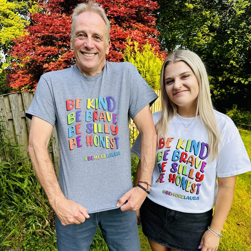 Dad, Mark, and sister, Gracie, modelling their ‘Be More Laura’ t-shirts that helped raise money for The Be More Laura Foundation