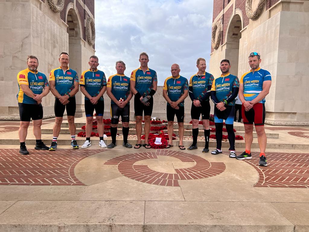 The Lewis Moody Foundation riders at a monument in memory of World War One soldiers who lost their lives during the war