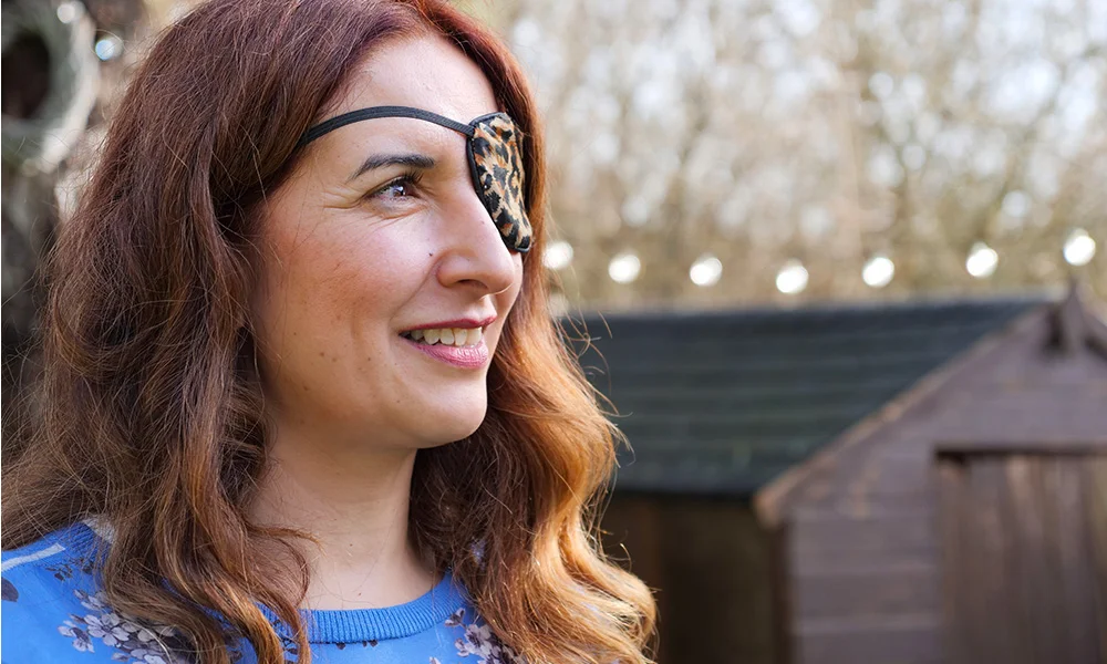 Israr close up wearing an eye patch