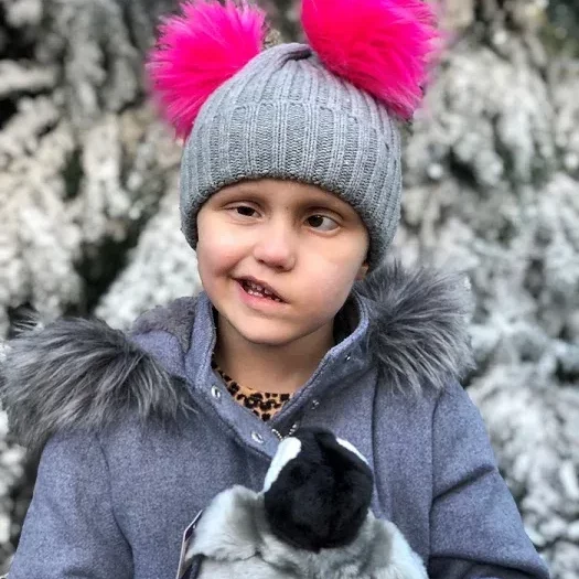 Ella holding a penguin