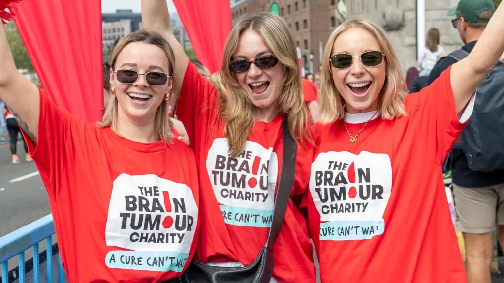 Three supporters of participants with disabilities at the London Marathon