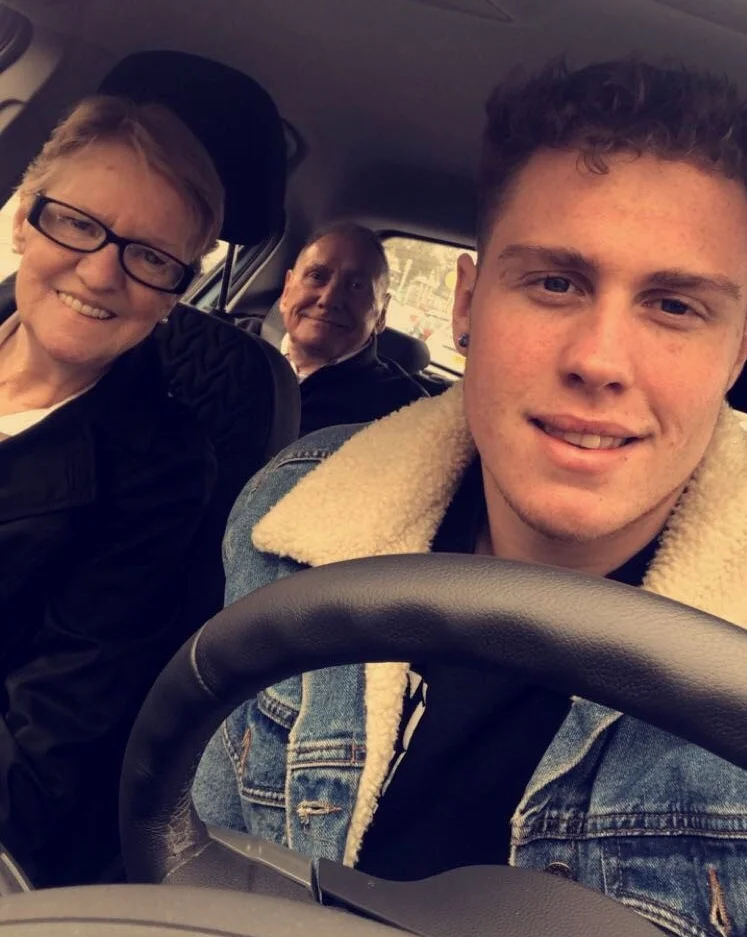 Jake Devline Reed and his grandparents in a car