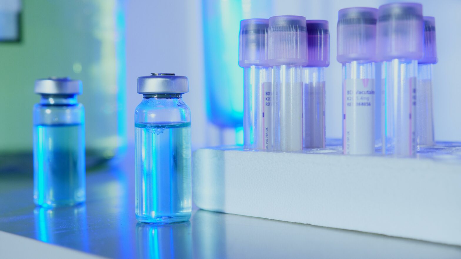 Vials on a table representing a clinical trial for dordaviprone, which is being developed to treat diffuse midline glioma