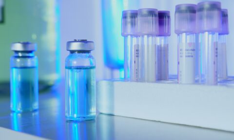 Vials on a table representing a clinical trial for dordaviprone, which is being developed to treat diffuse midline glioma