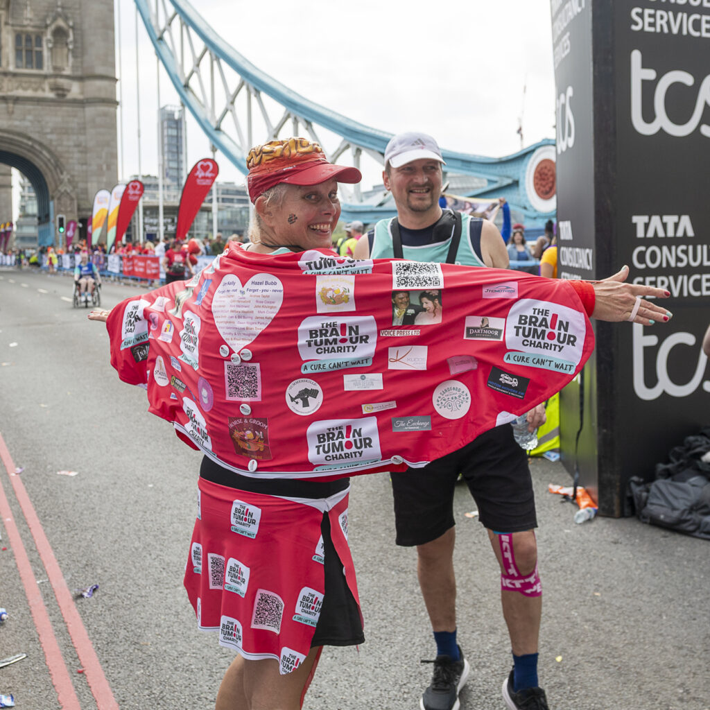 A supporter wrapped in The Brain Tumour Charity merch at TCS London Marathon