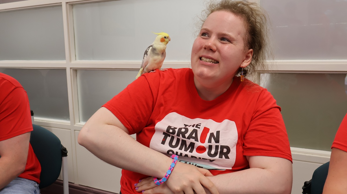 Young Ambassador with a bird on her shoulder