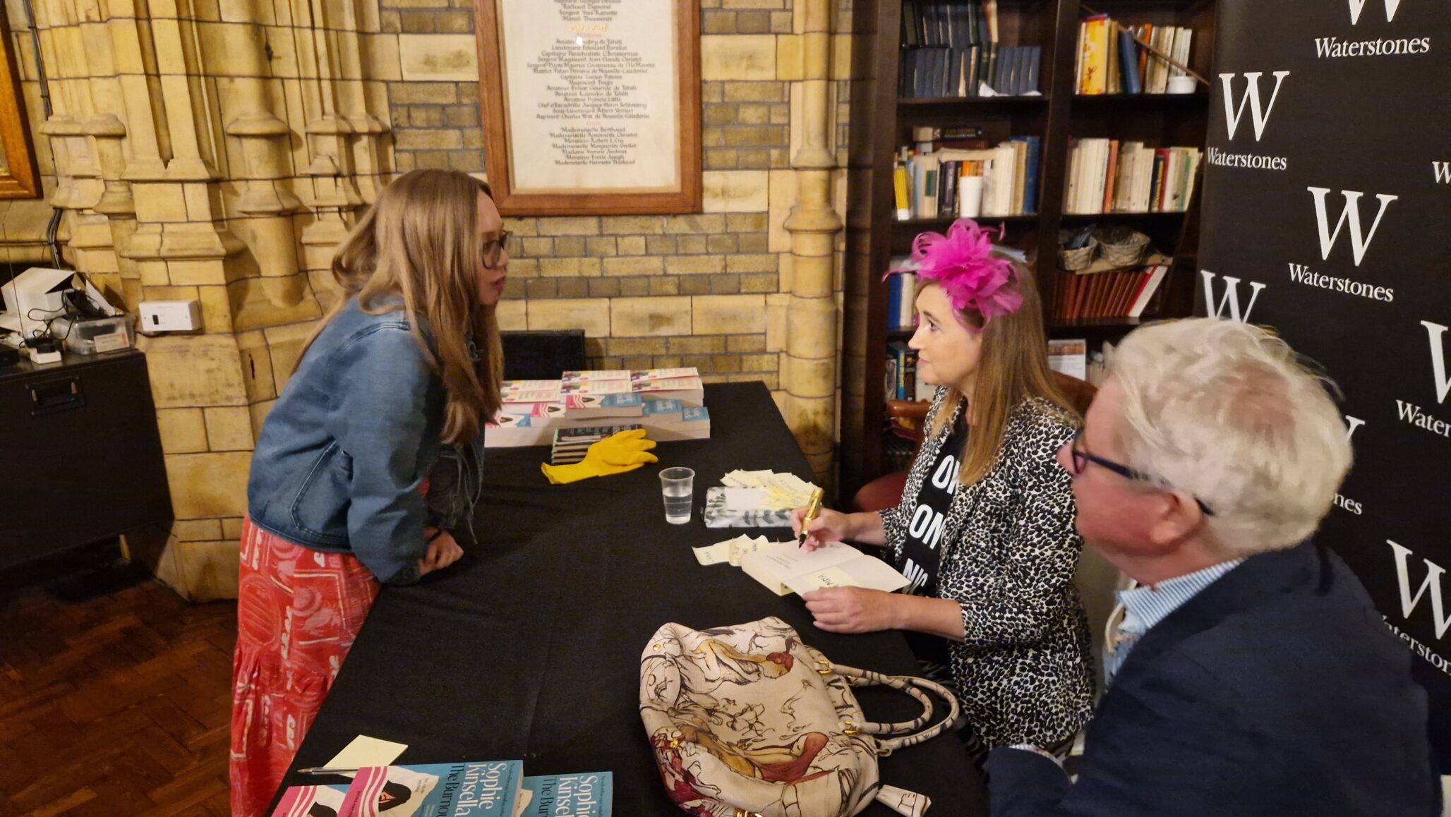 Sophie meets a fan at a signing table