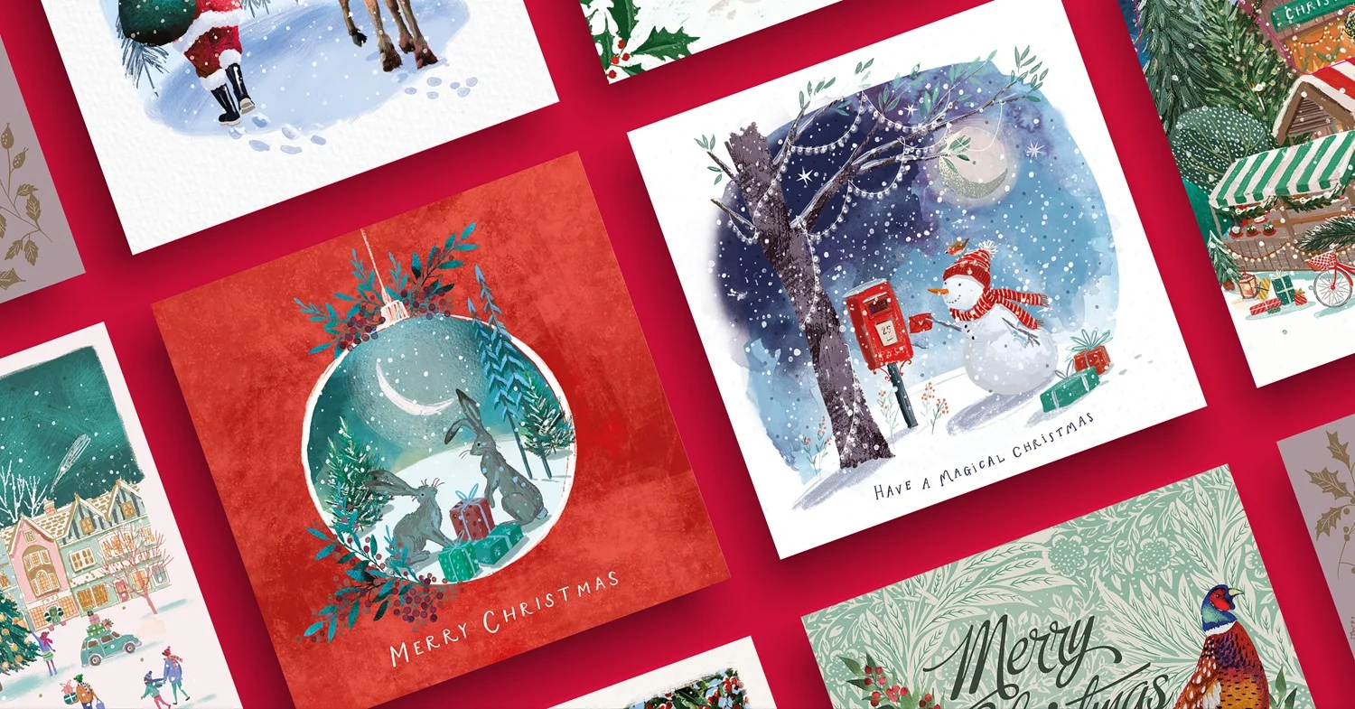 An assortment of The Brain Tumour Charity Christmas cards on a red background
