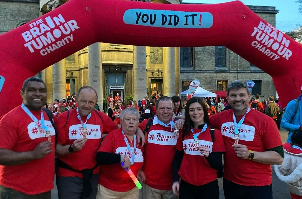 Chris, centre, with his wife Sue, family and friends at the Twilight Walk finish line