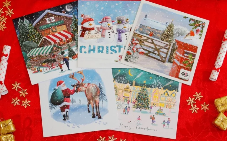The Brain Tumour Charity Christmas card collection on a red background surrounded by gold decorations