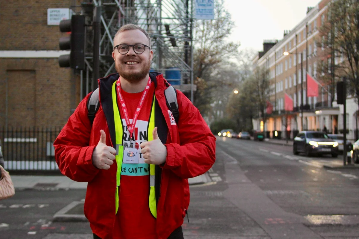 A route volunteer at The Twilight Walk gives the thumbs up