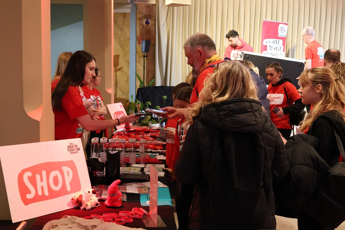 People working at the shop table during The Twilight Walk