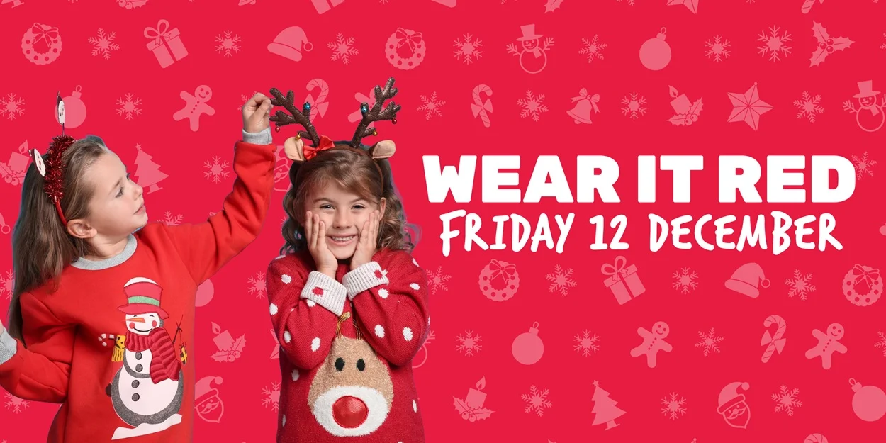 Two young girls wearing red Christmas jumpers for The Brain Tumour Charity's Wear it Red fundraising day in December
