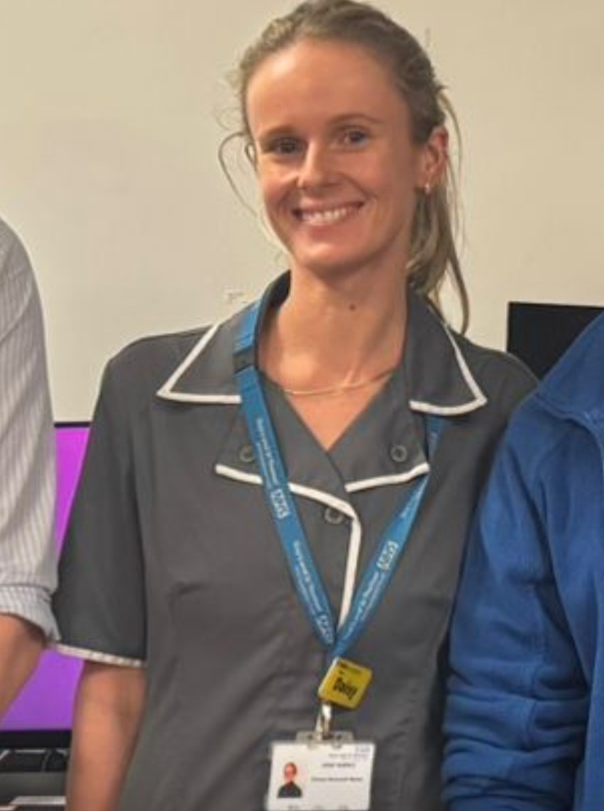Daisy, a clinical research nurse, in uniform at work