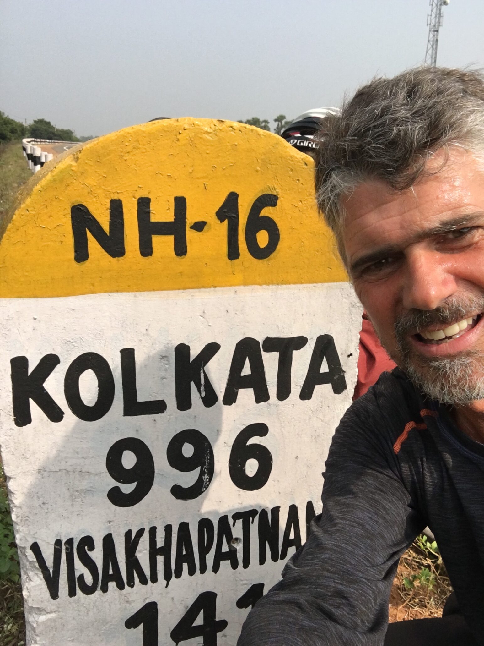 Mark takes a photo in front of a road sign reading NH-16, Kolkata 996