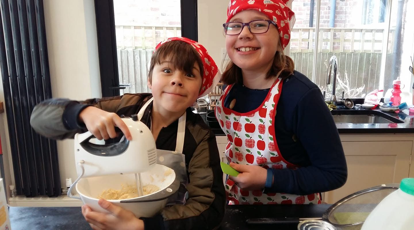 Children holding a mixer, baking for The Big Bake