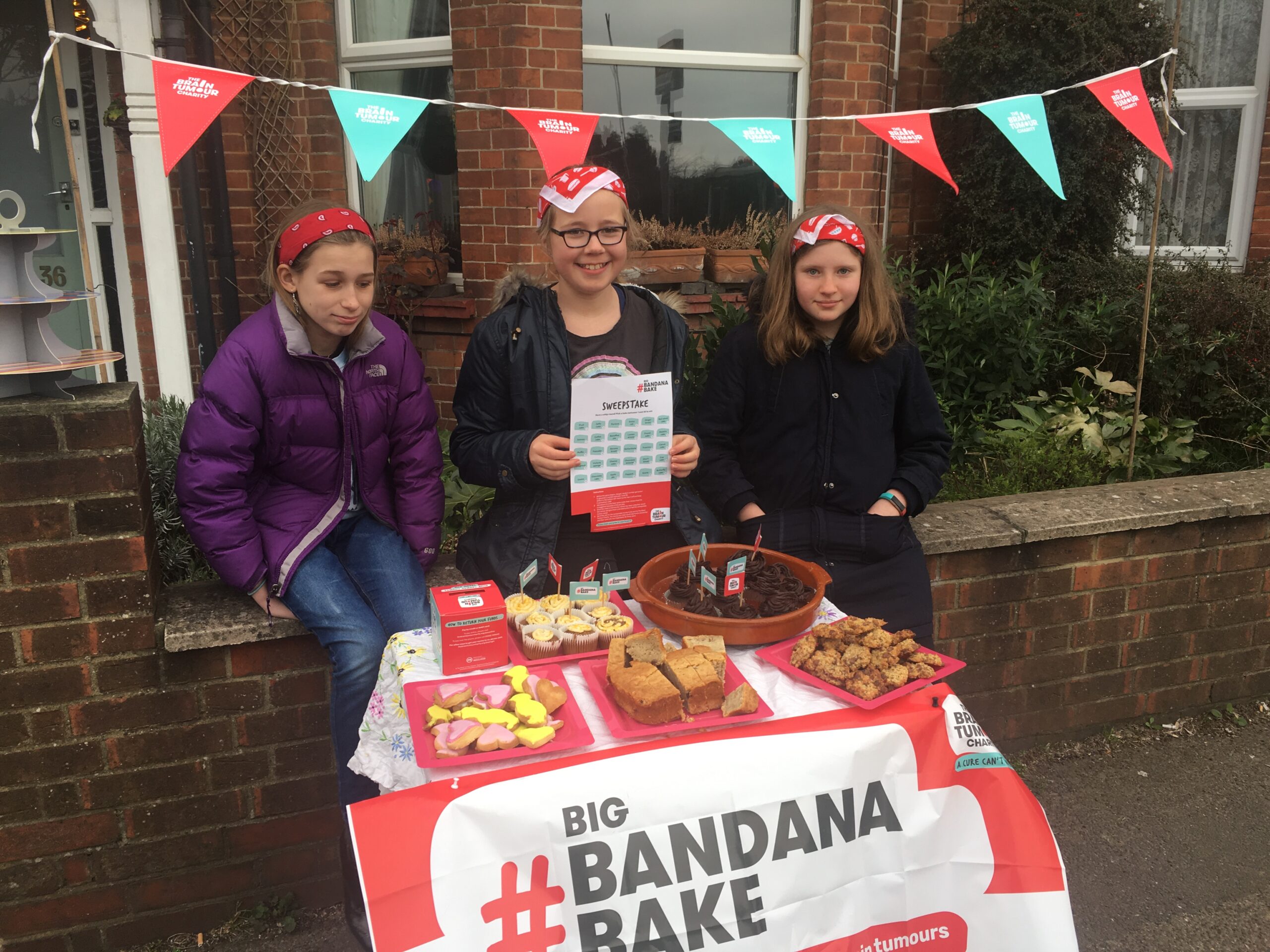 Lily taking part in The Brain Tumour Charity's Big Bandana Bake - now the Big Bake