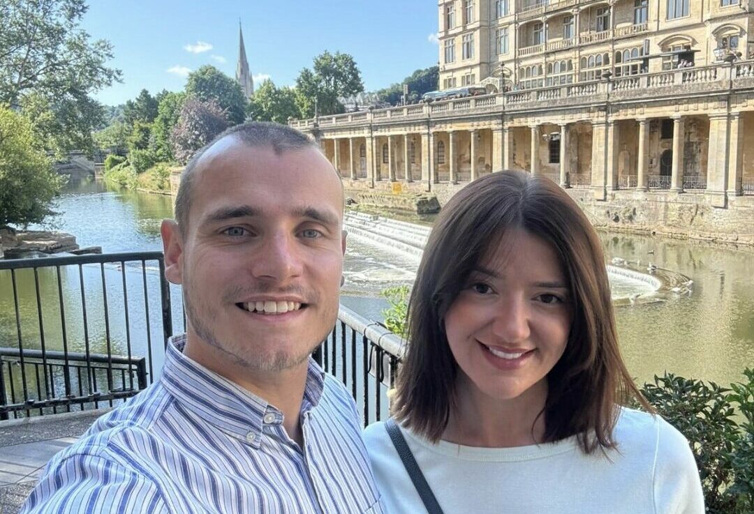 Mitch and Gemma in front of an old building