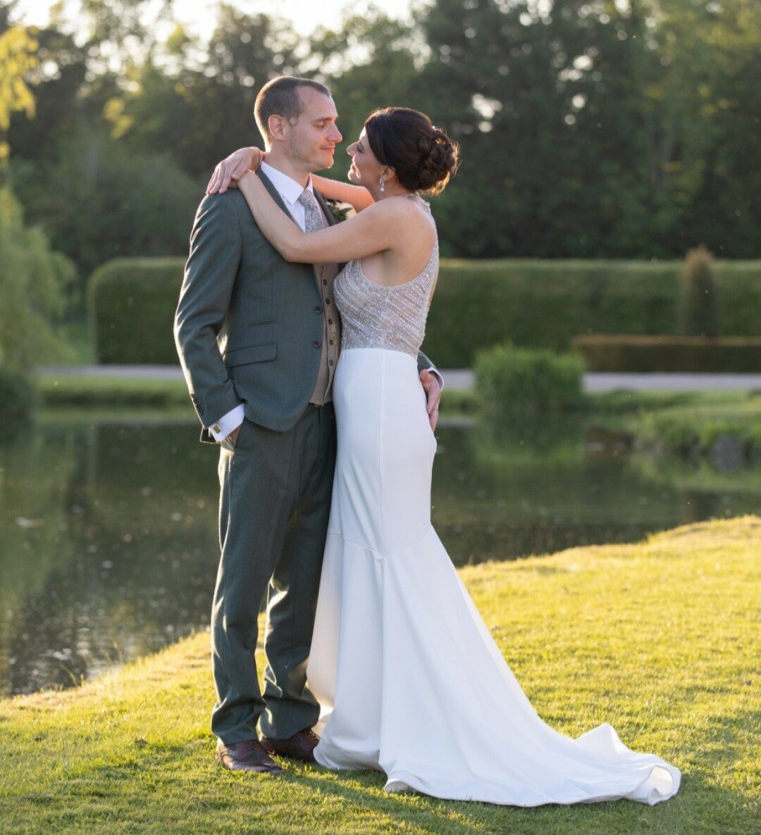 Mitch and Gemma hold each other for a wedding photo